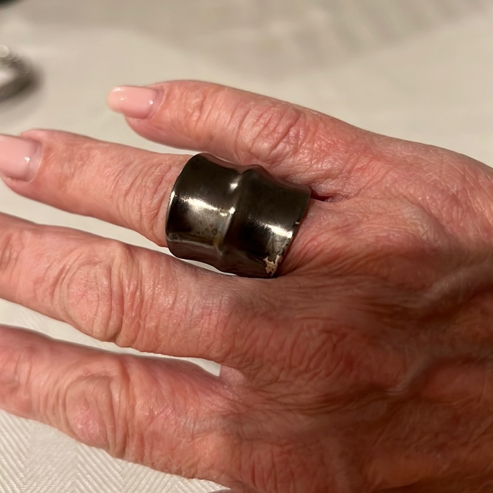 Bronze tone Dannijo ring.